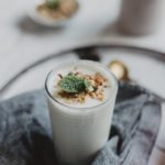 white liquid in clear drinking glass