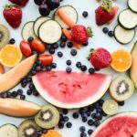 sliced fruits on white surface